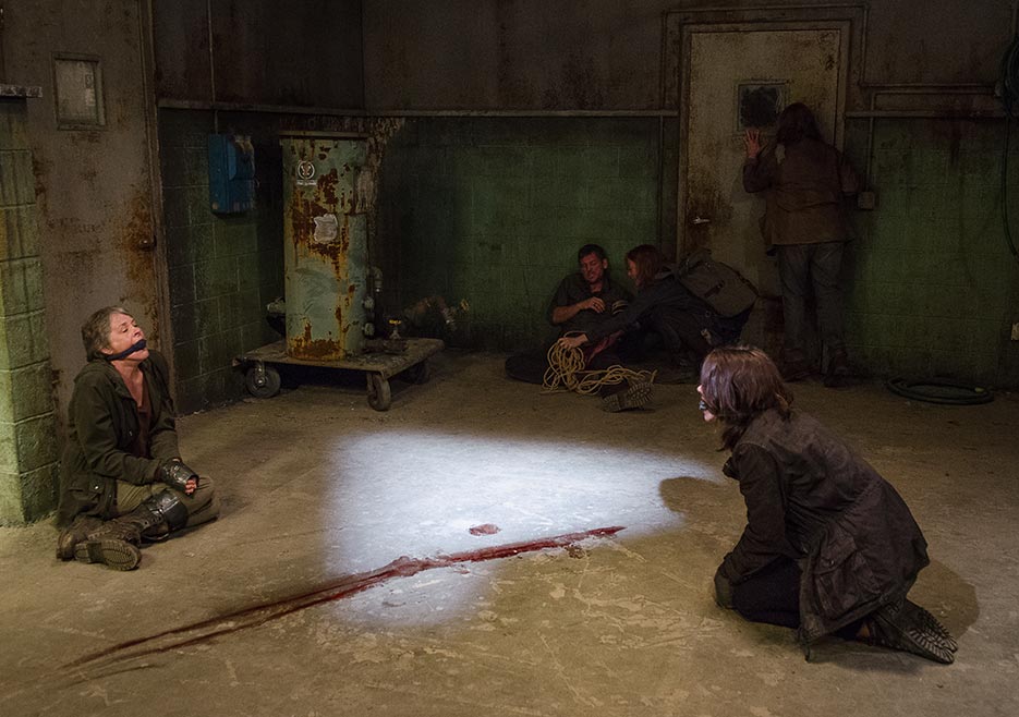 Note that the bloodstain is probably the cleanest part of this gross as fuck room. Photo courtesy of AMC.
